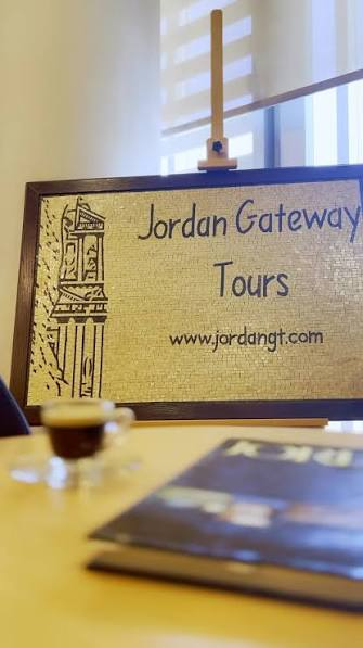 Jordan Gateway Tours mosaic sign with the Petra Treasury, displayed in our Amman office